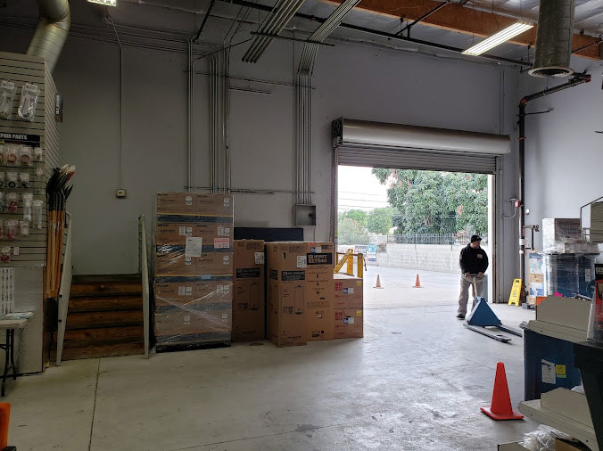Plumbing supply warehouse interior with door open